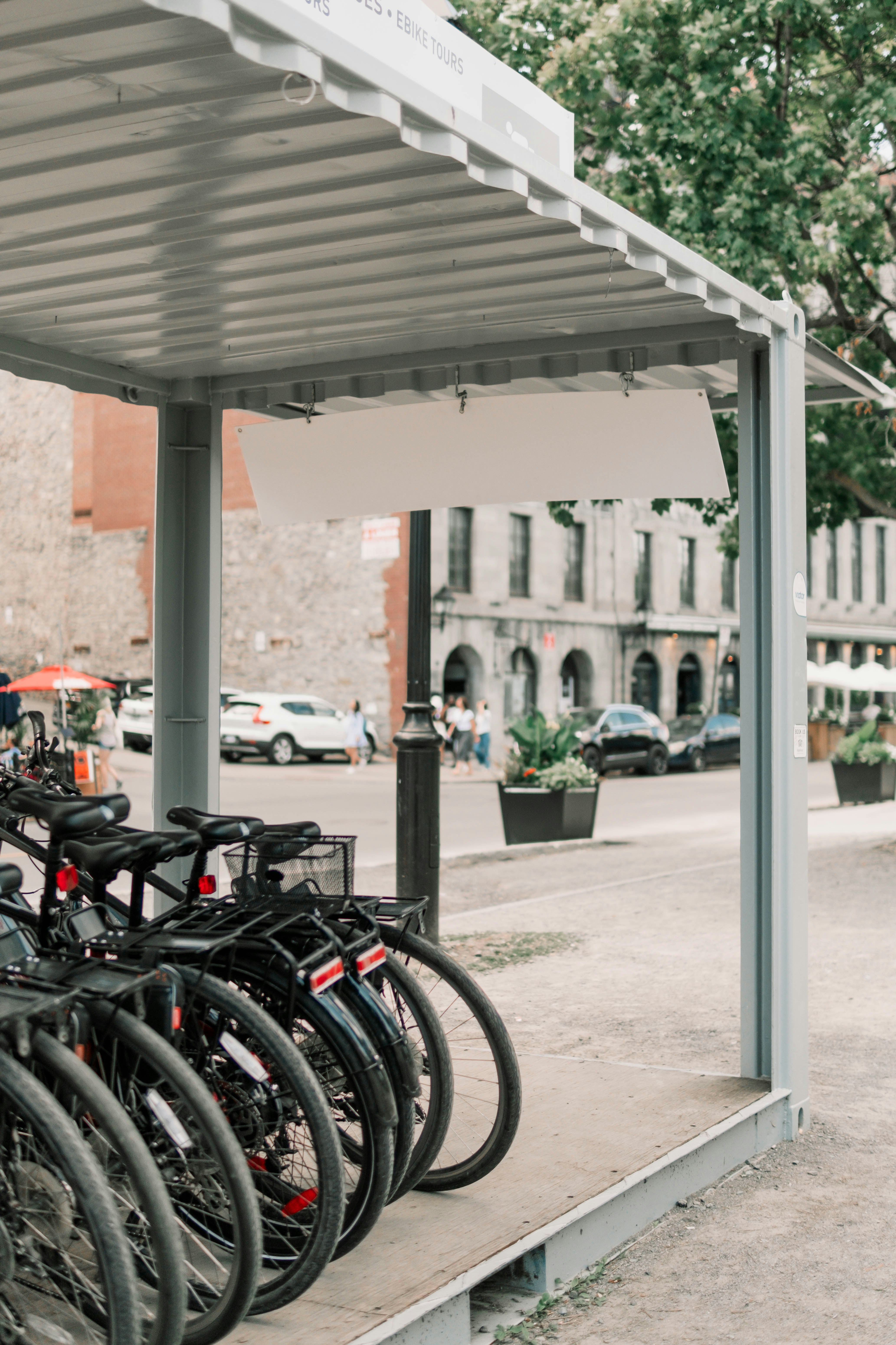 a group of bicycles parked under a covered area