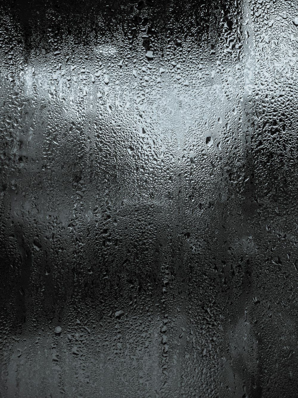 a black and white photo of a grey surface