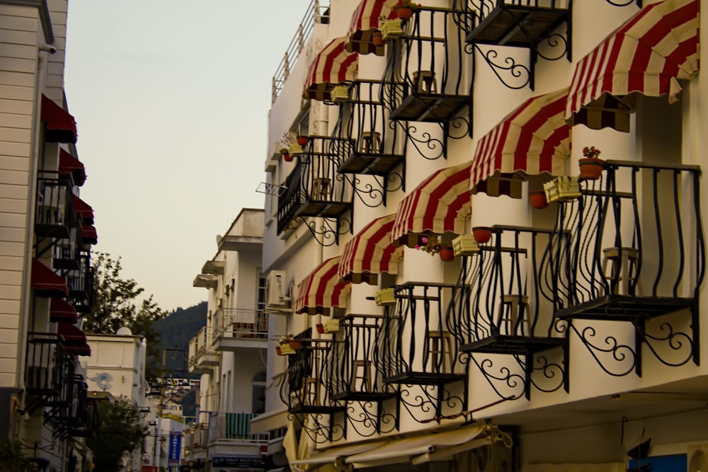 a row of buildings with flags