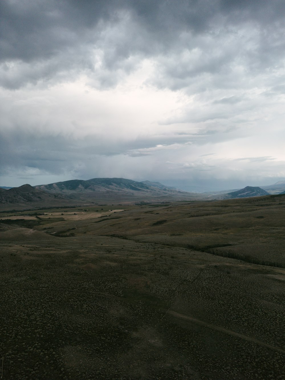 a landscape with hills in the back