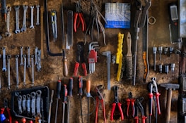 Emergency plumbing tools neatly organized on a workshop table for quick access.