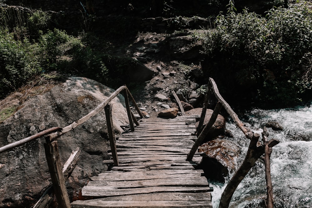 a wooden bridge over a river