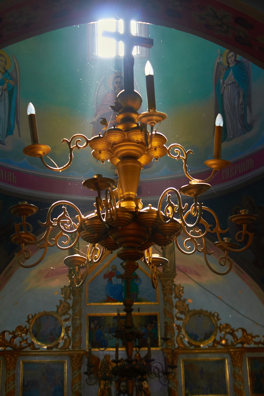 a gold and ornate chandelier
