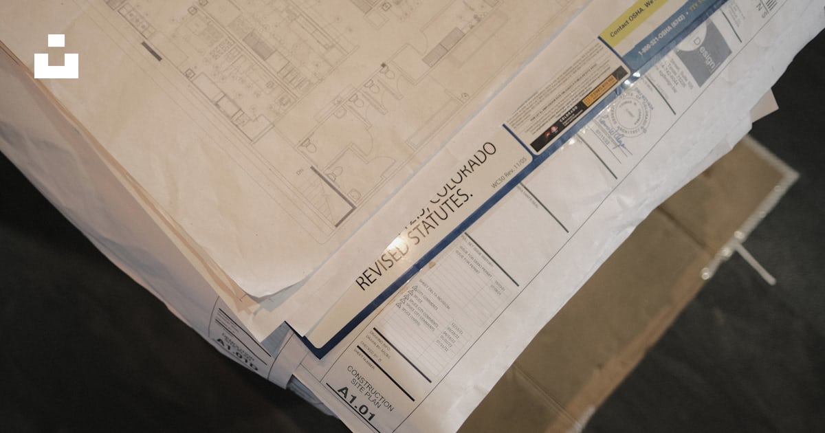 A stack of flyers on a table photo – Free Text Image on Unsplash