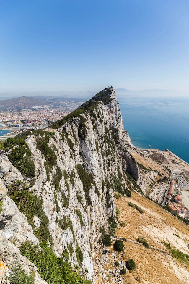 The dramatic limestone ridge of the Rock of Gibraltar above the Mediterranean coast