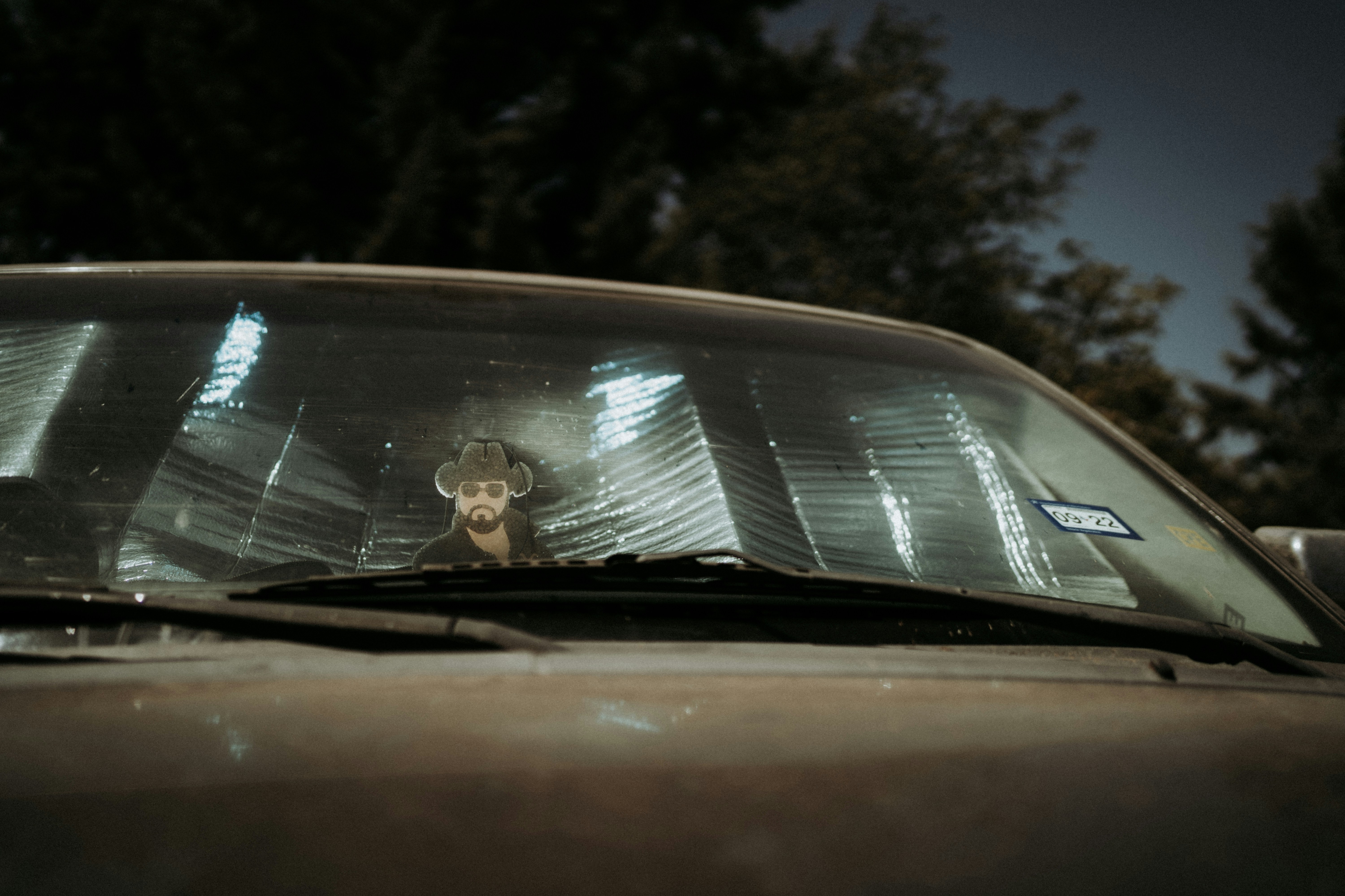 a person in a car windshield after