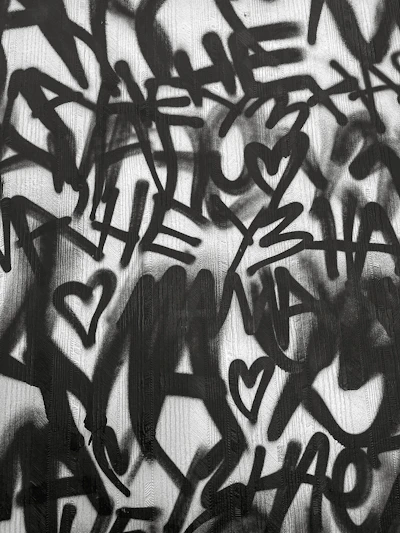 a black and white image of a person's face