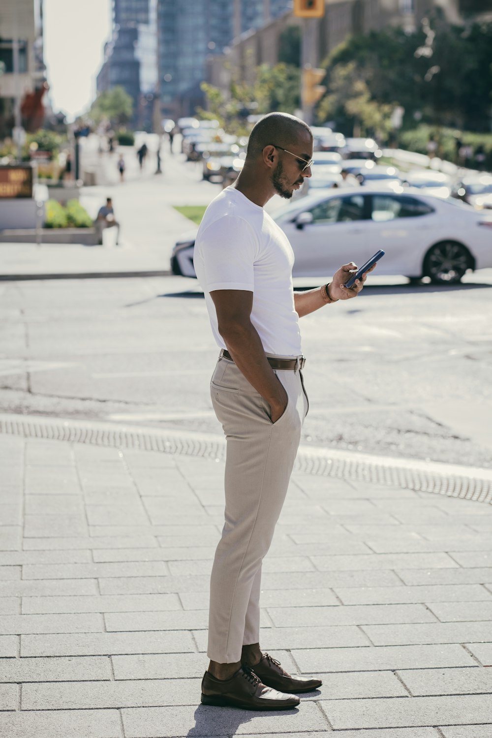 a man standing on a sidewalk