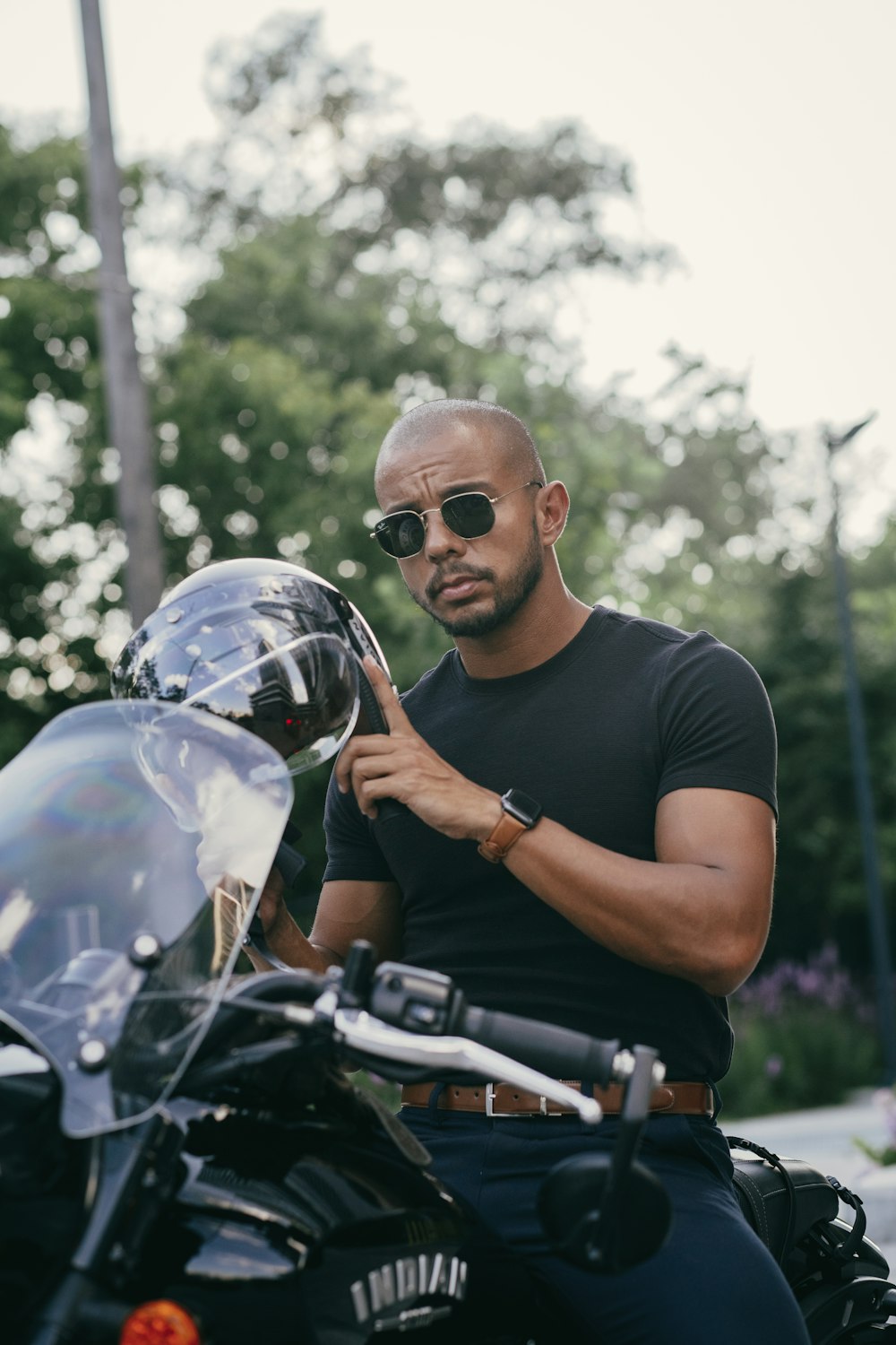 a man sitting on a motorcycle