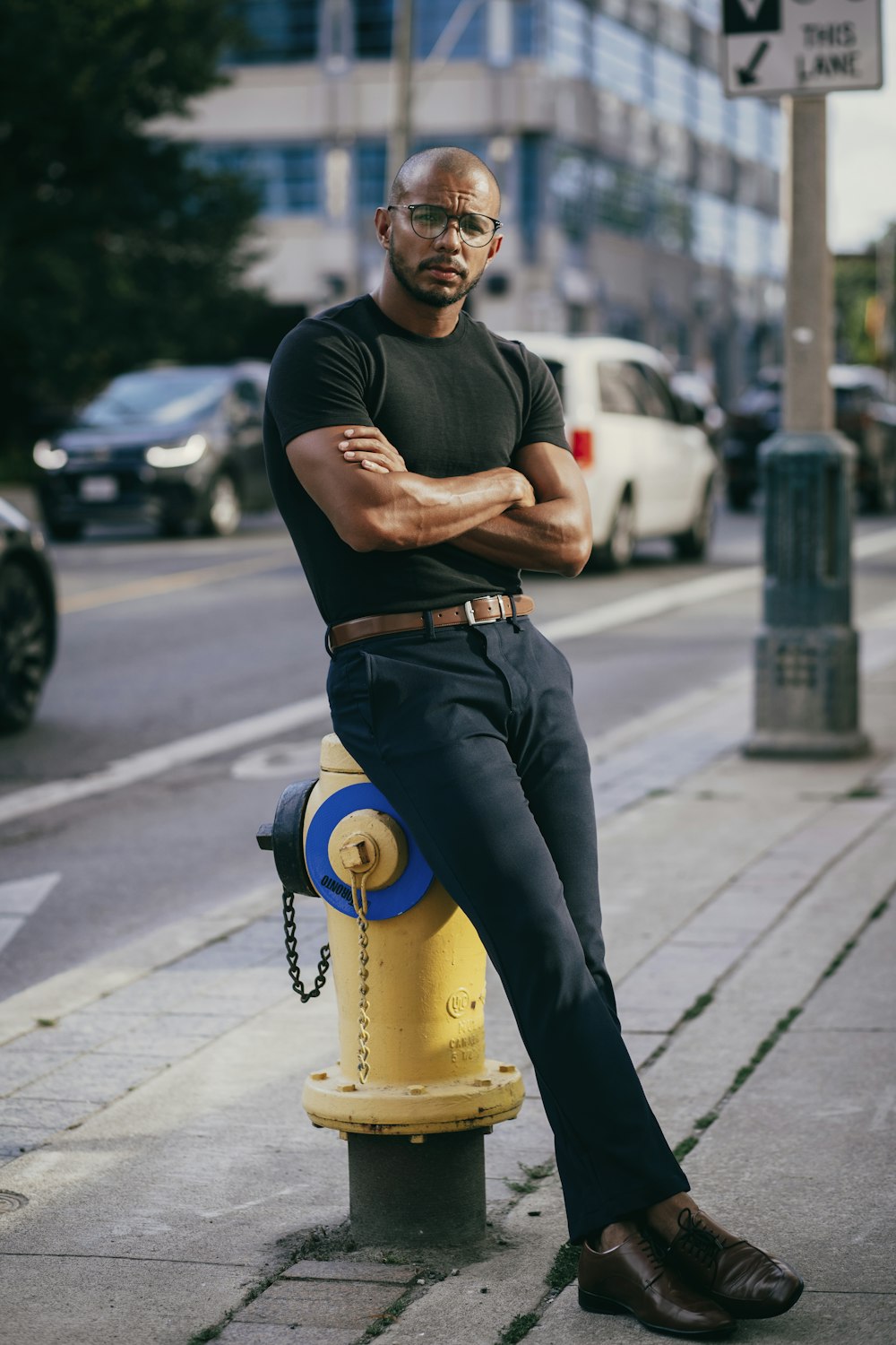 a man leaning on a fire hydrant
