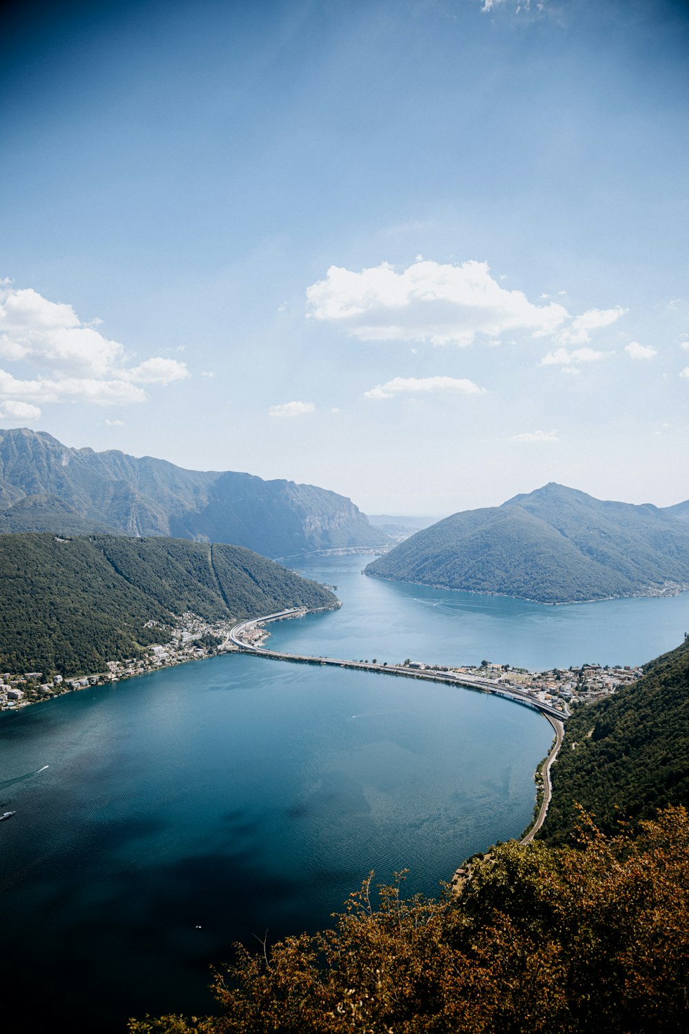 a body of water with mountains in the background