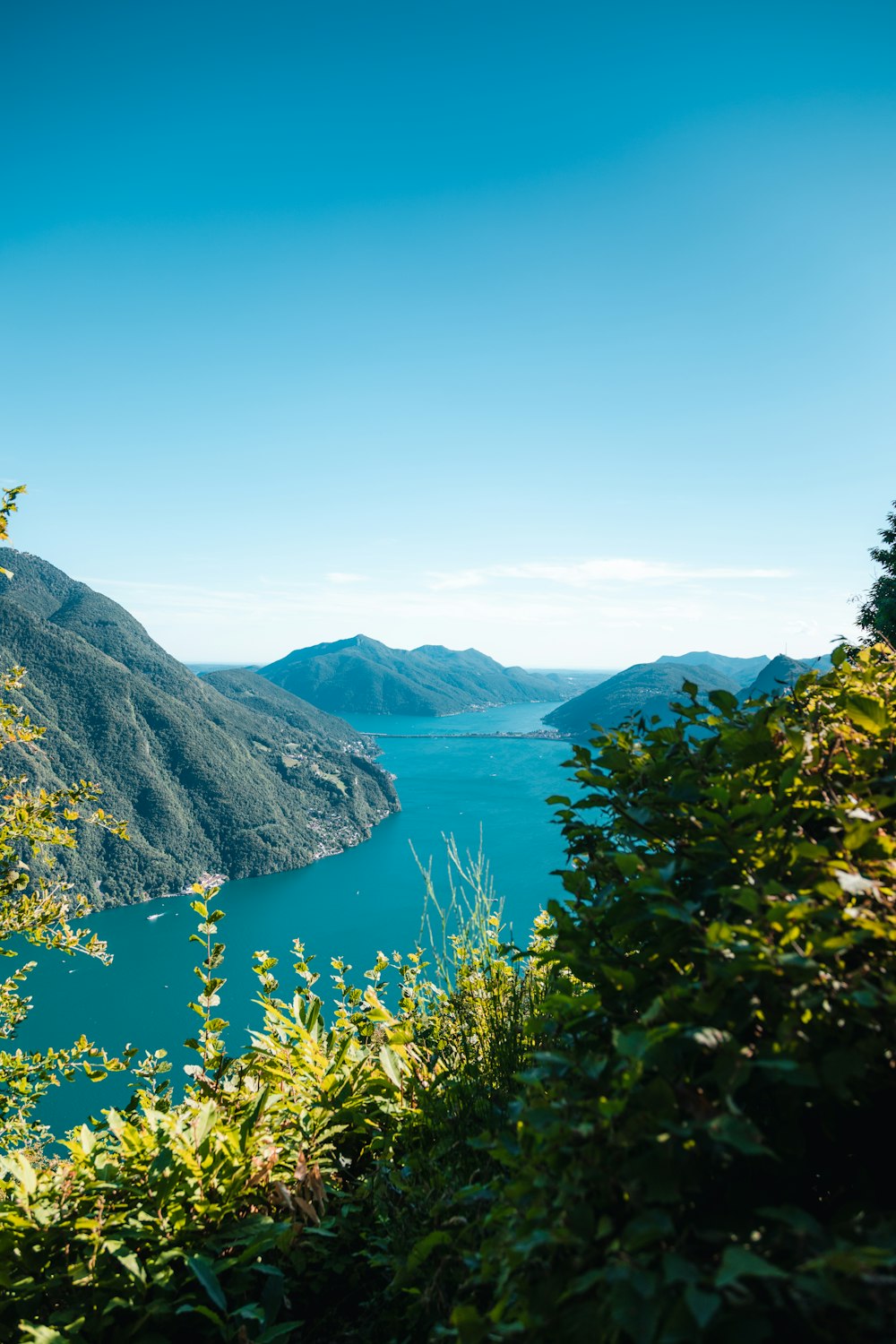 a body of water with mountains in the background