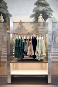 A sleek, modern clothing rack showcasing a variety of stylish casual wear in a bright, clean store setting.