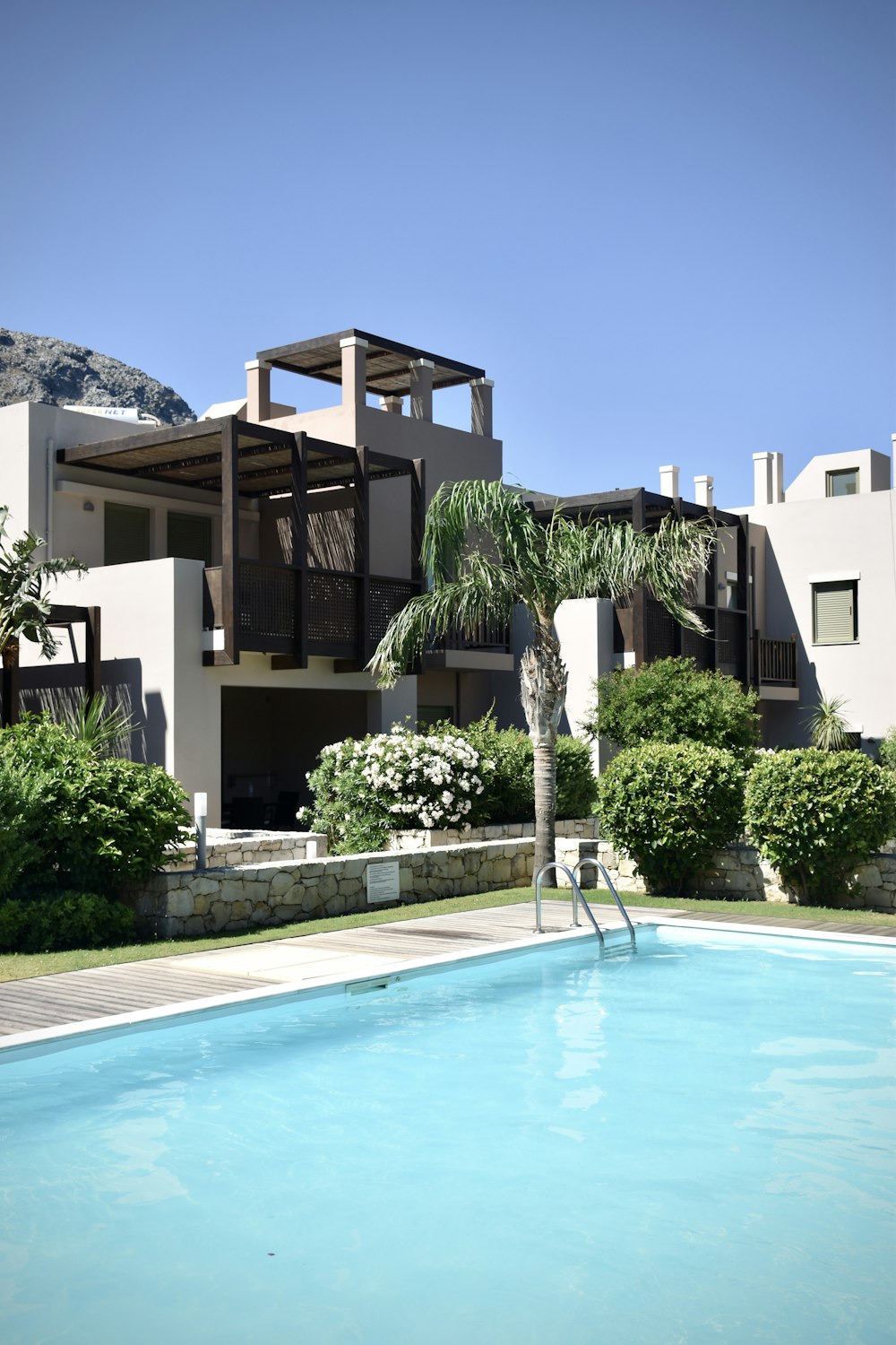 a pool in front of a house