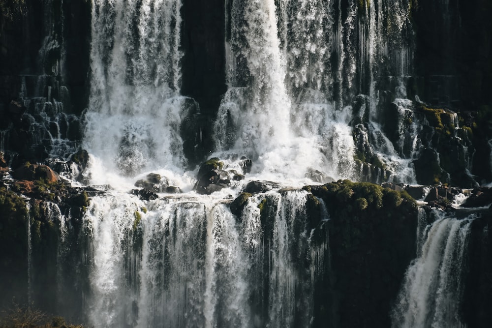 a waterfall with rocks