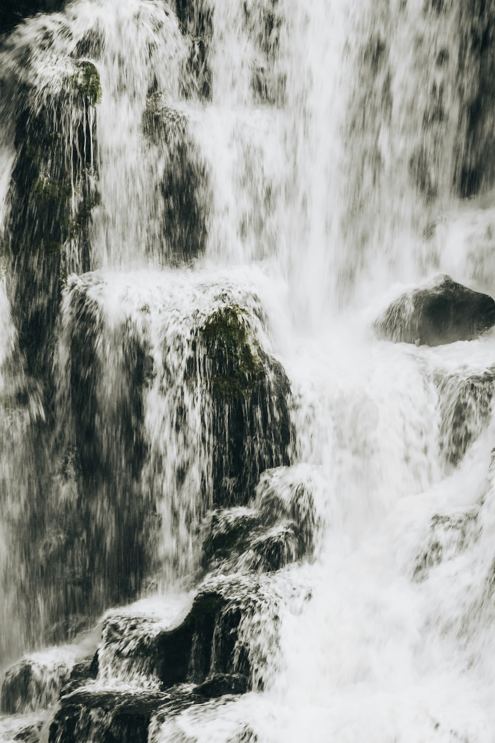 a waterfall with rocks