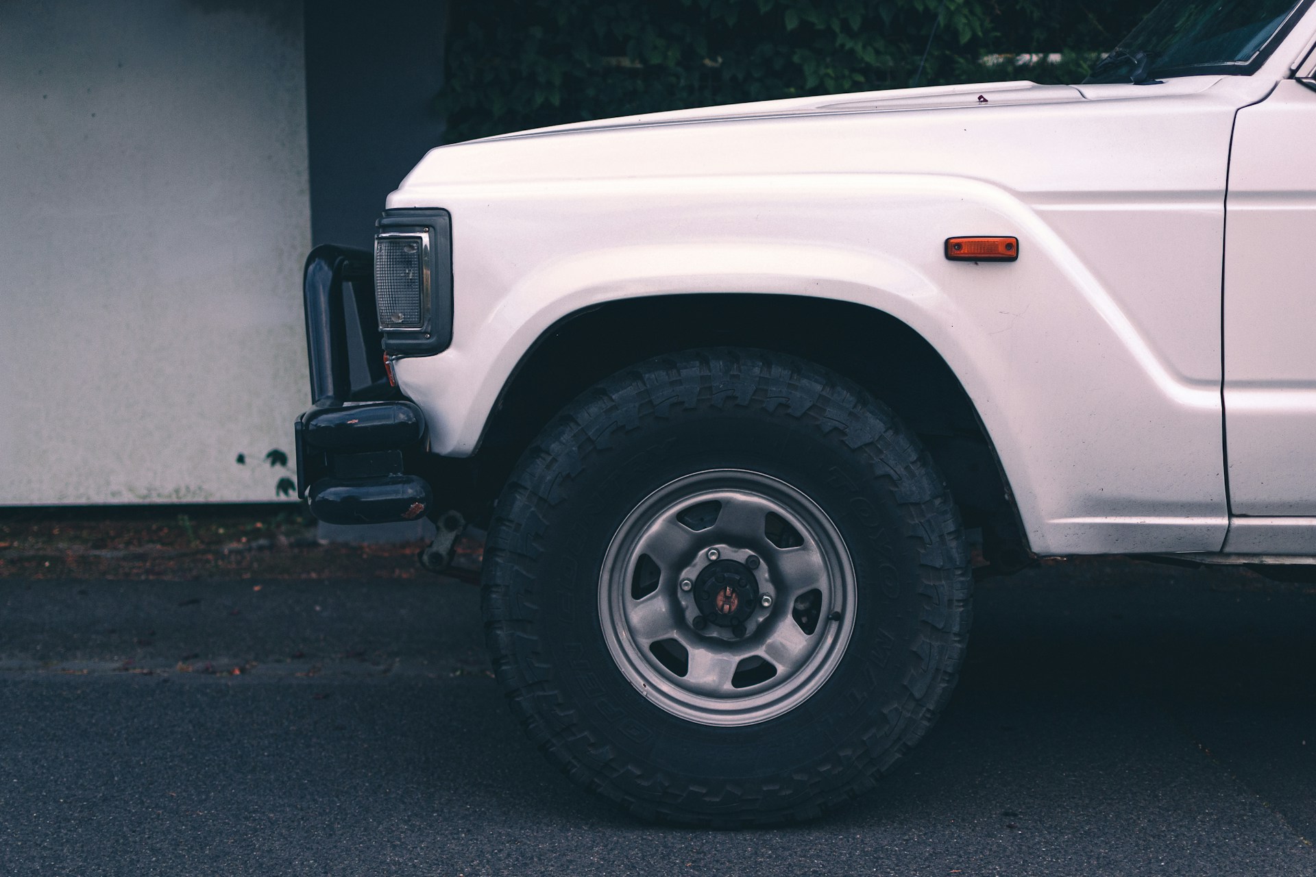a white car with a flat tire