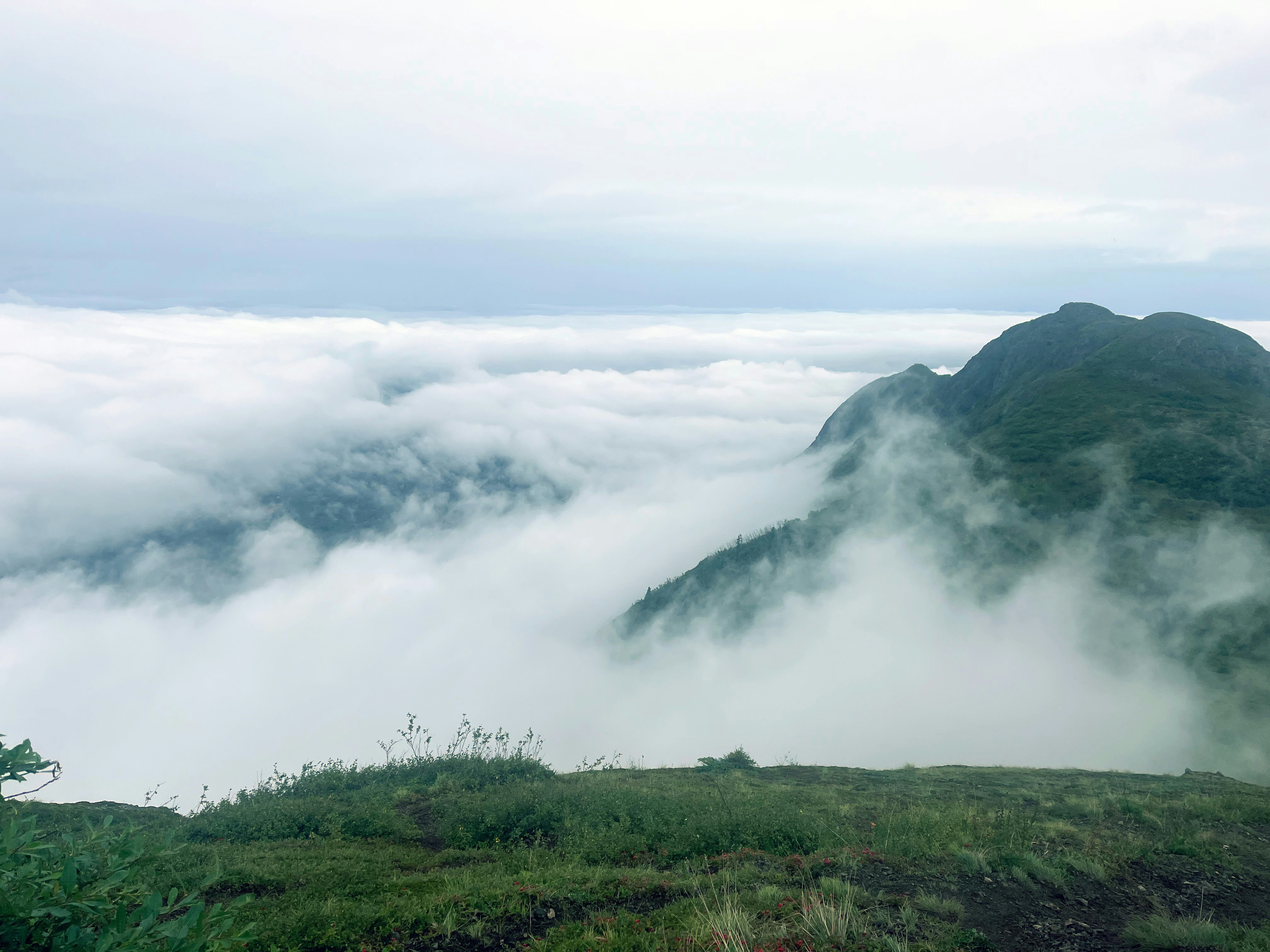 a mountain with clouds, 