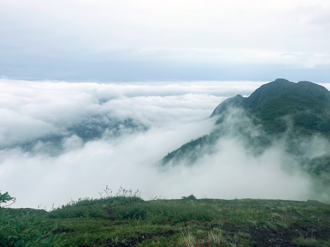 a mountain with clouds,