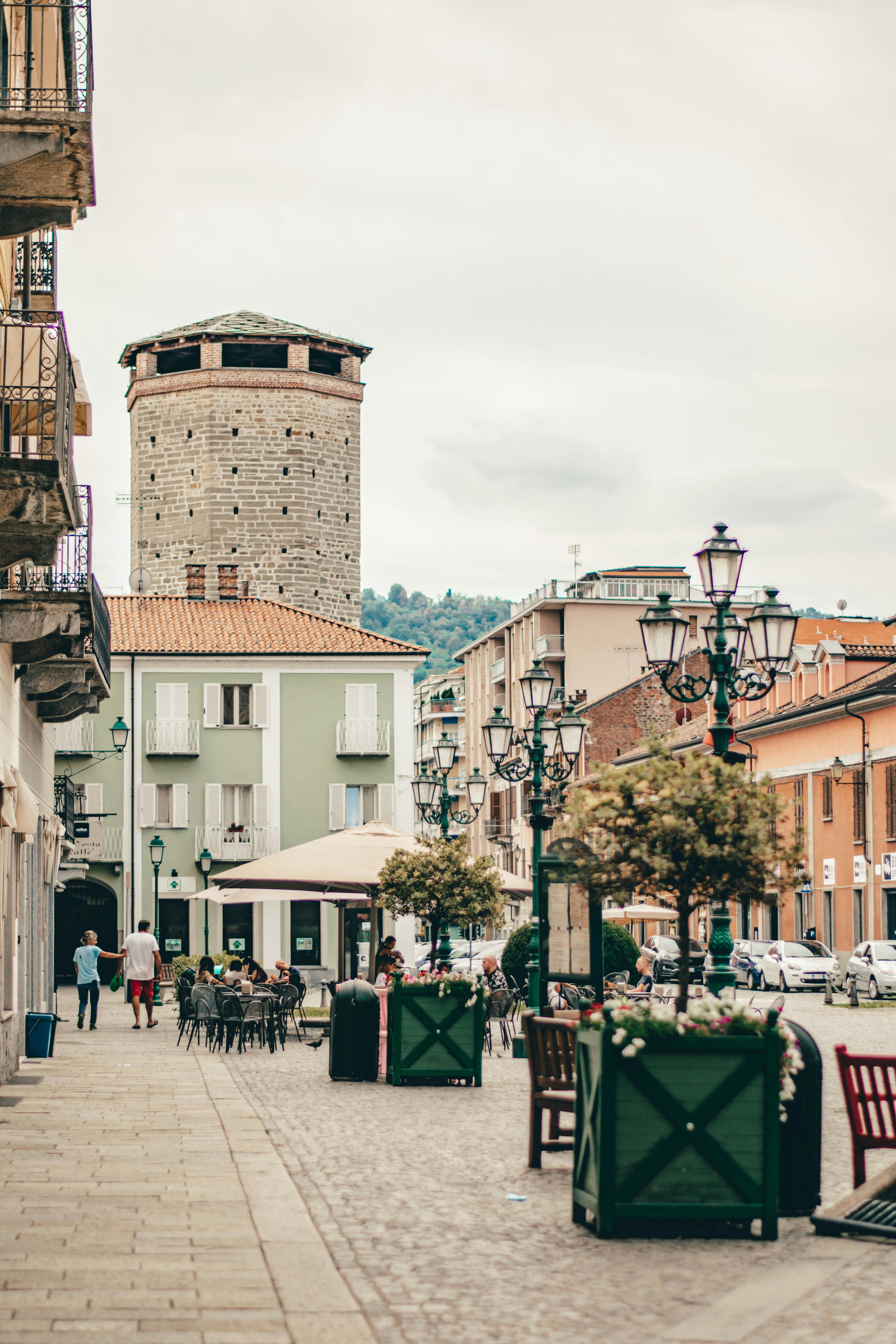 a brick tower in a city