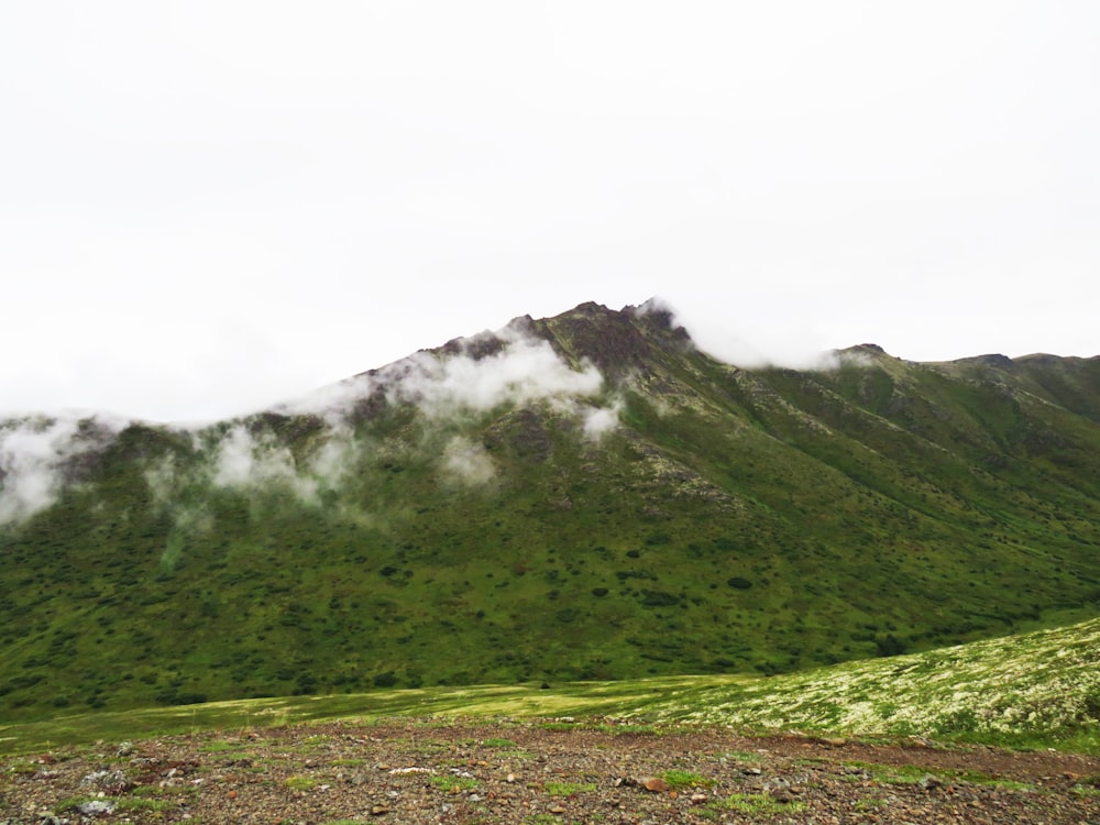 a mountain with clouds