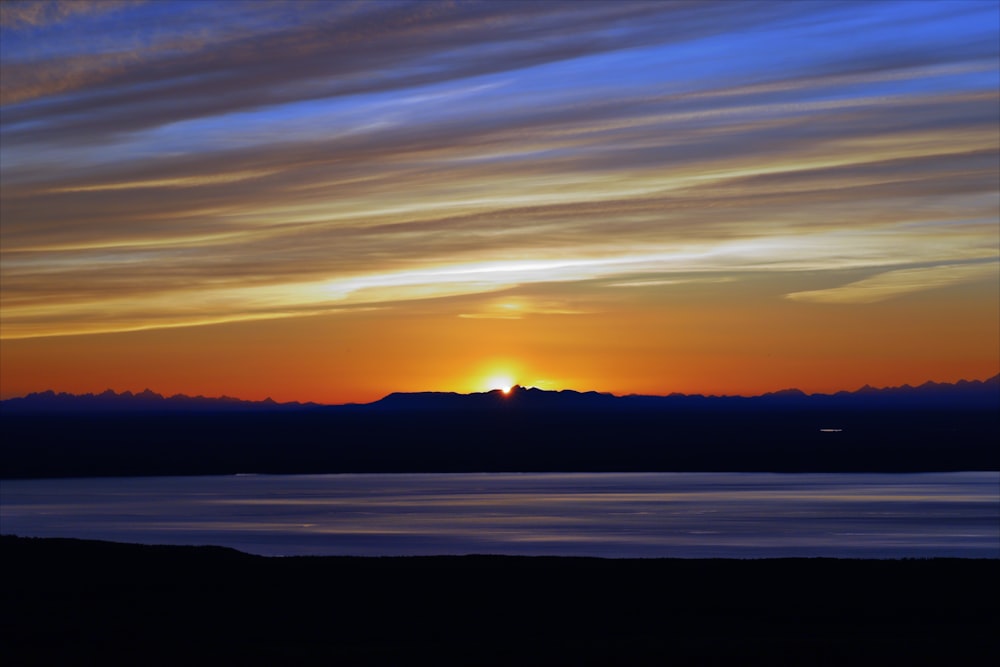 a sunset over a lake