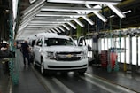 Assembly line workers carefully installing parts in Guangxi Zhongxing Daoyuan cars