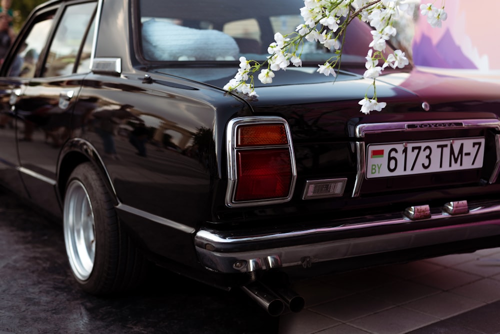 a car with a flower on the back