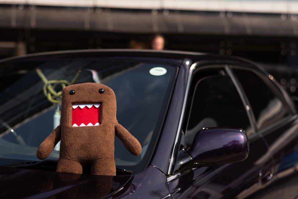 a stuffed animal in a car