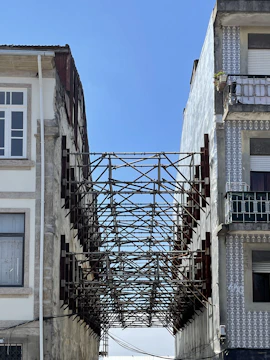 a metal gate between buildings