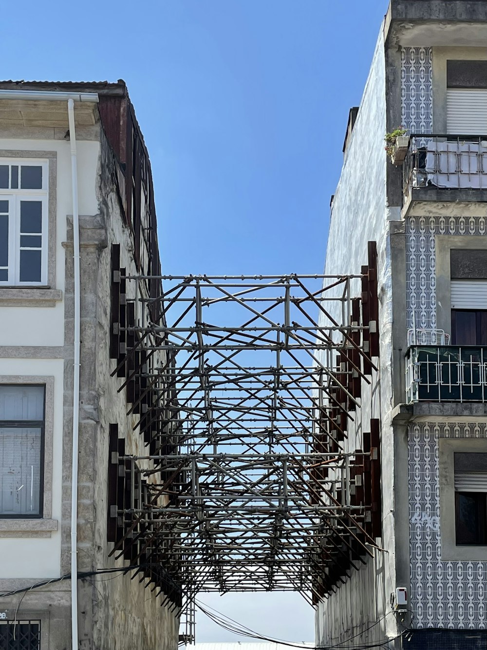 a metal gate between buildings