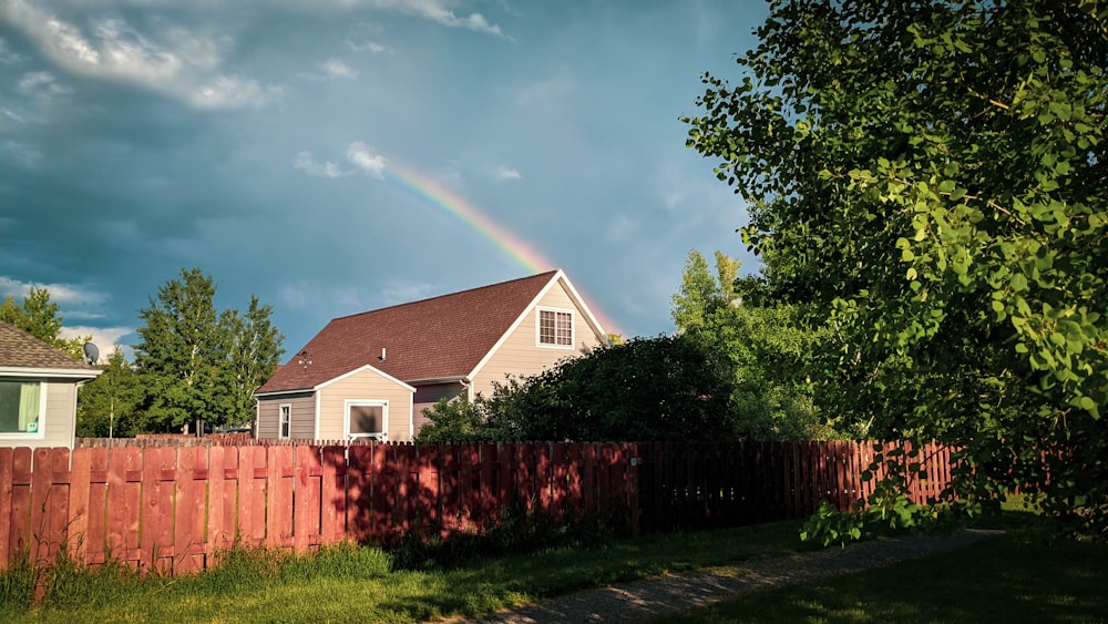 a rainbow over a house