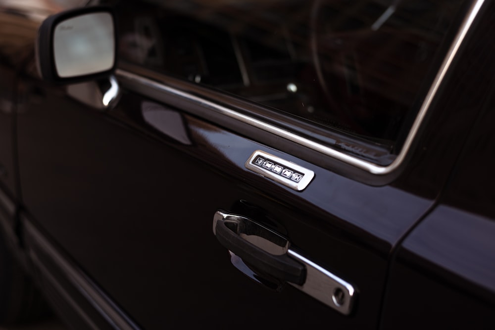 a close up of a car's door handle