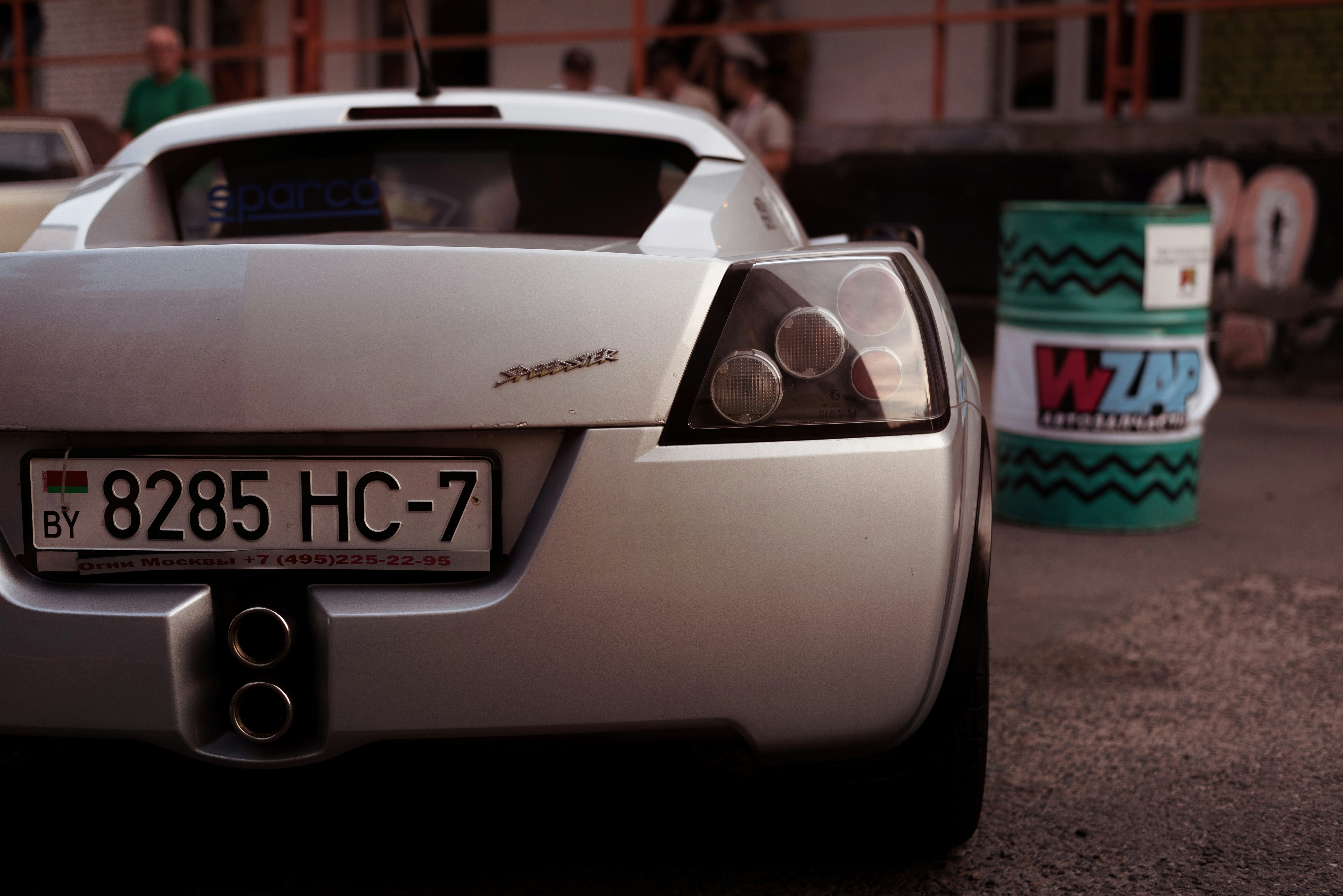 a white car with a green box on the front