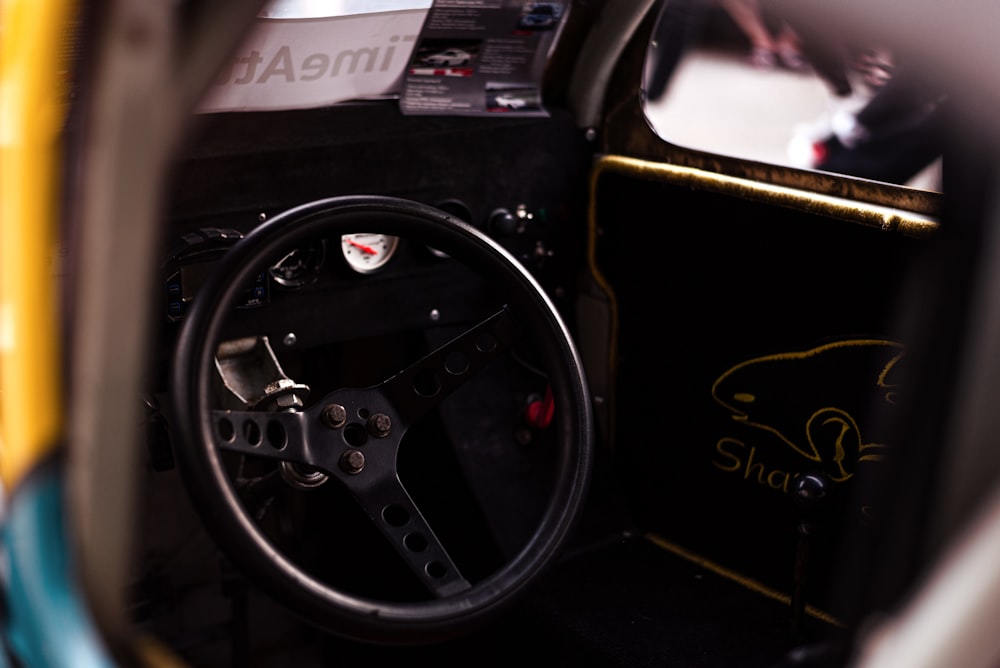 a steering wheel and dashboard of a car