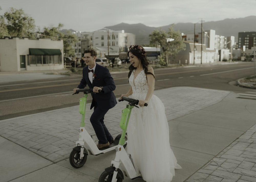 a man and woman on a scooter