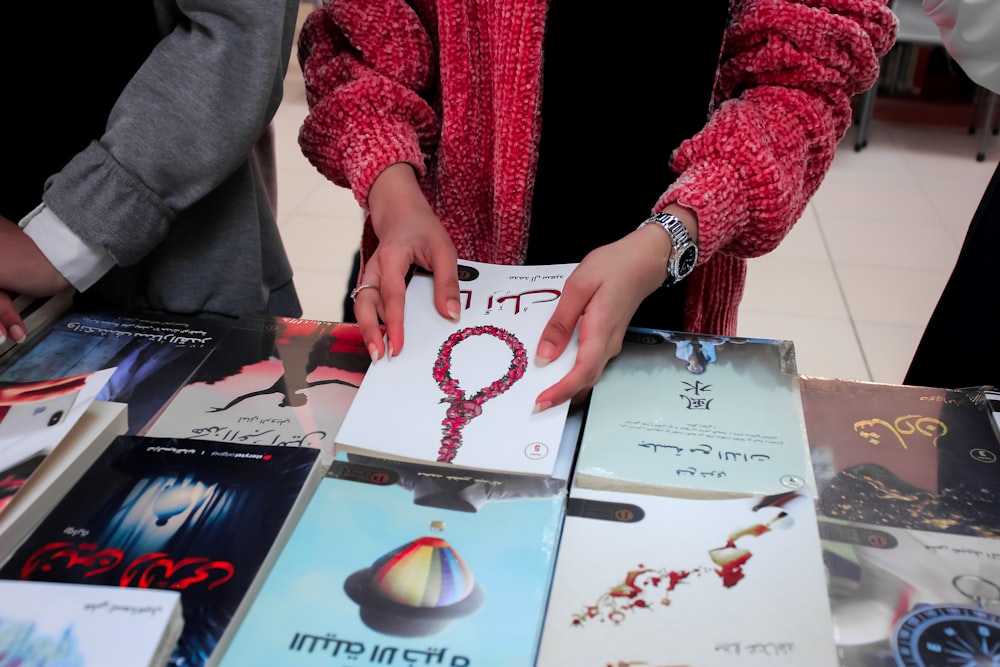 a person drawing on a book