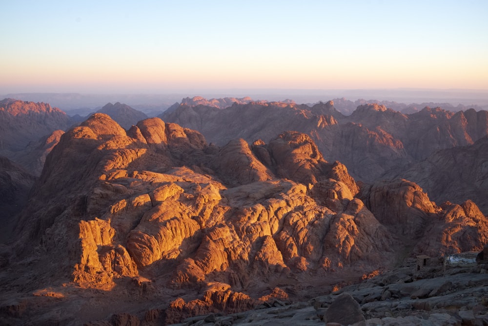 a rocky canyon with a blue sky