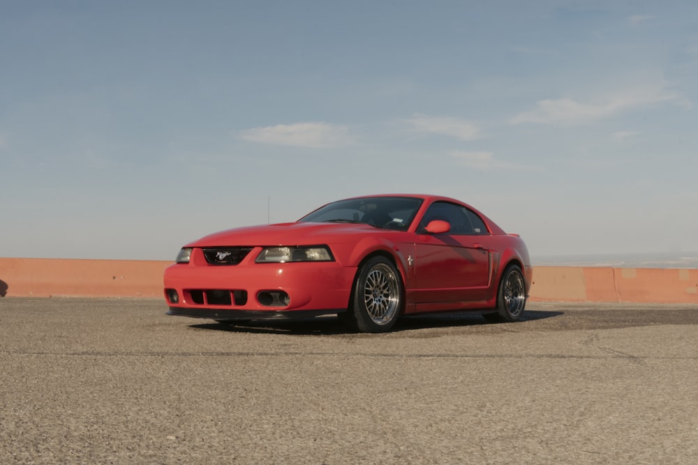 a red car parked on a road