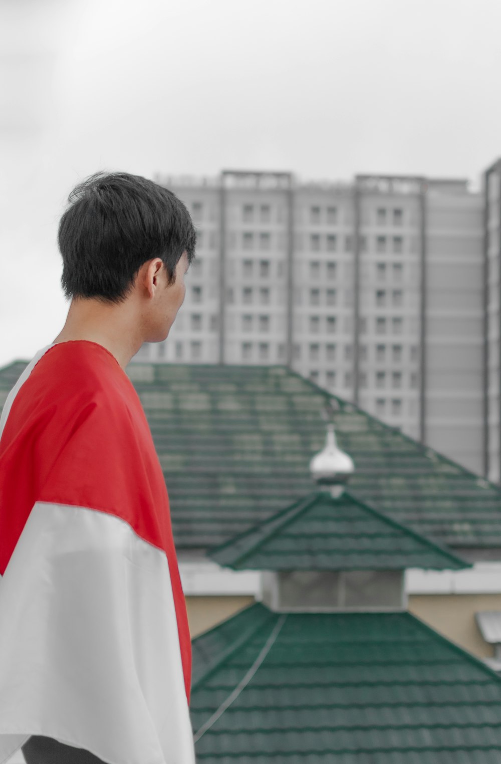 a man looking at a rooftop