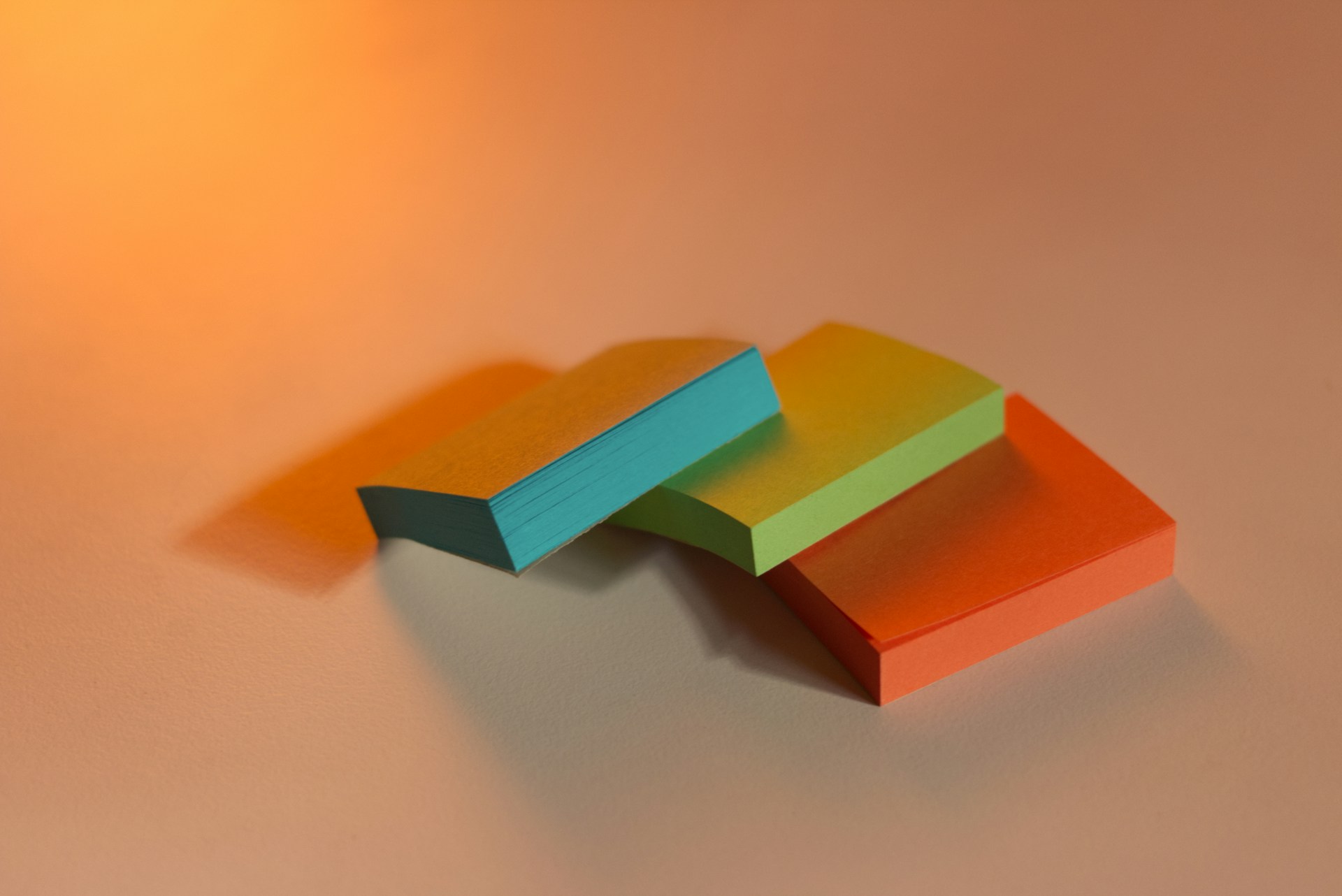 a stack of colorful paper