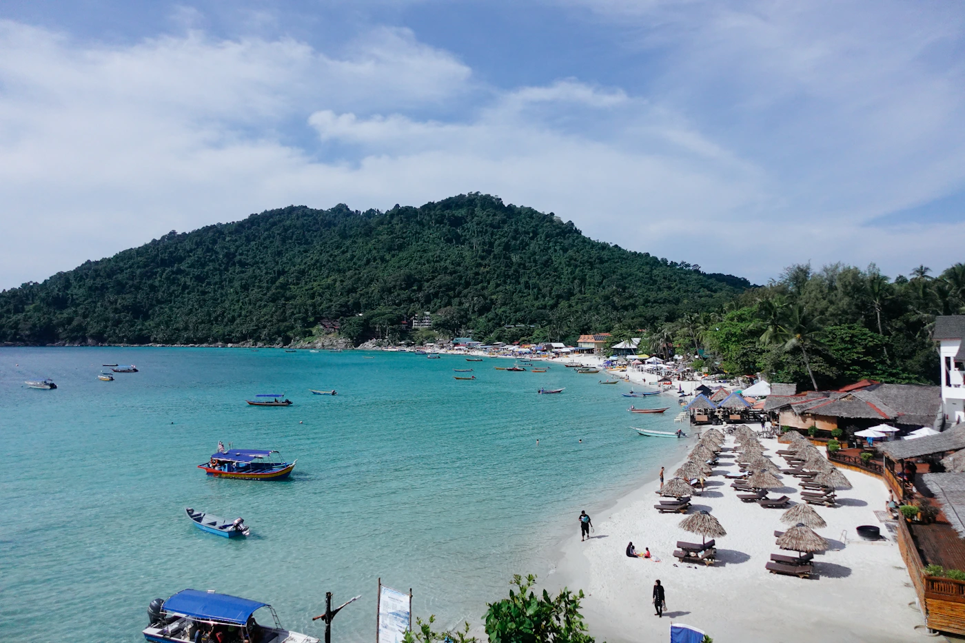 Beach, boats and tropical water at Pulau Perhentian, Malaysia
