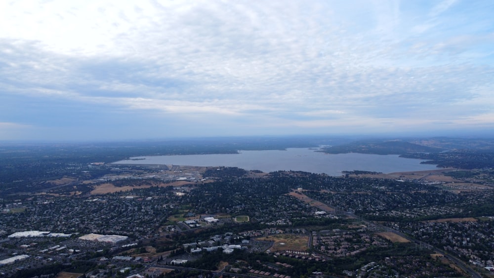 a city with a body of water in the background