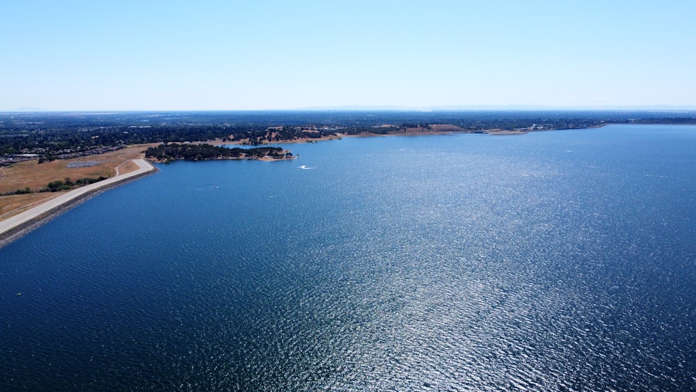 a body of water with land in the distance