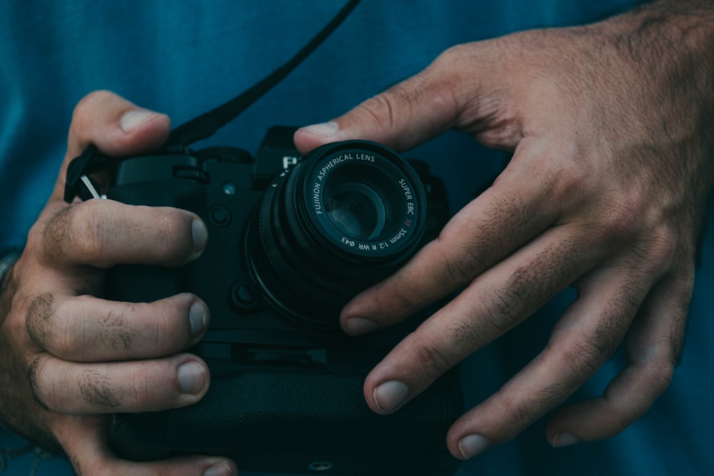 a person holding a camera