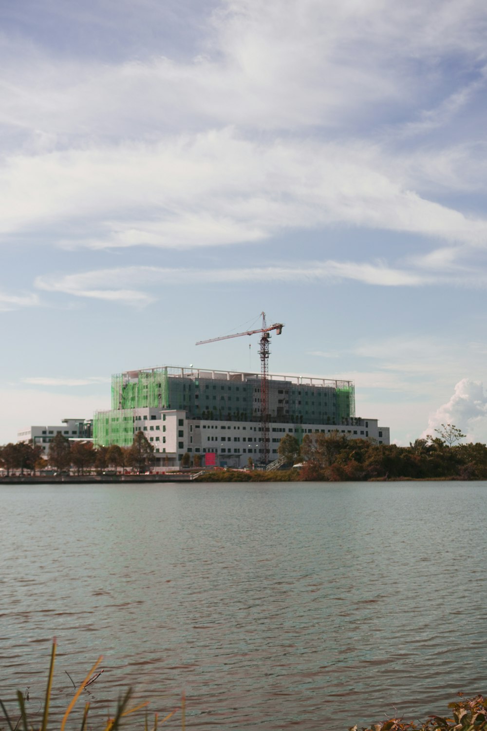 a body of water with a building in the background