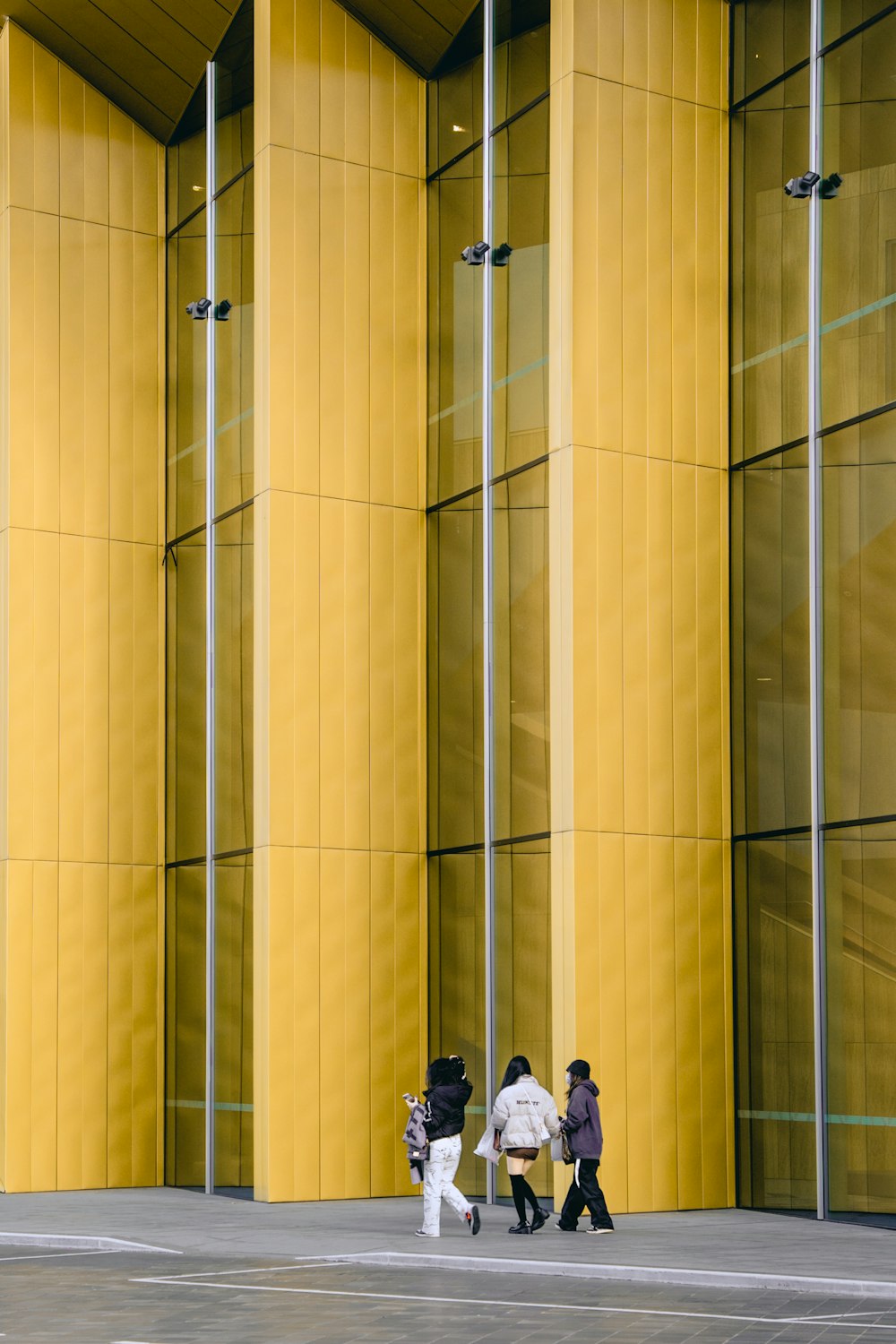 people walking in front of a building