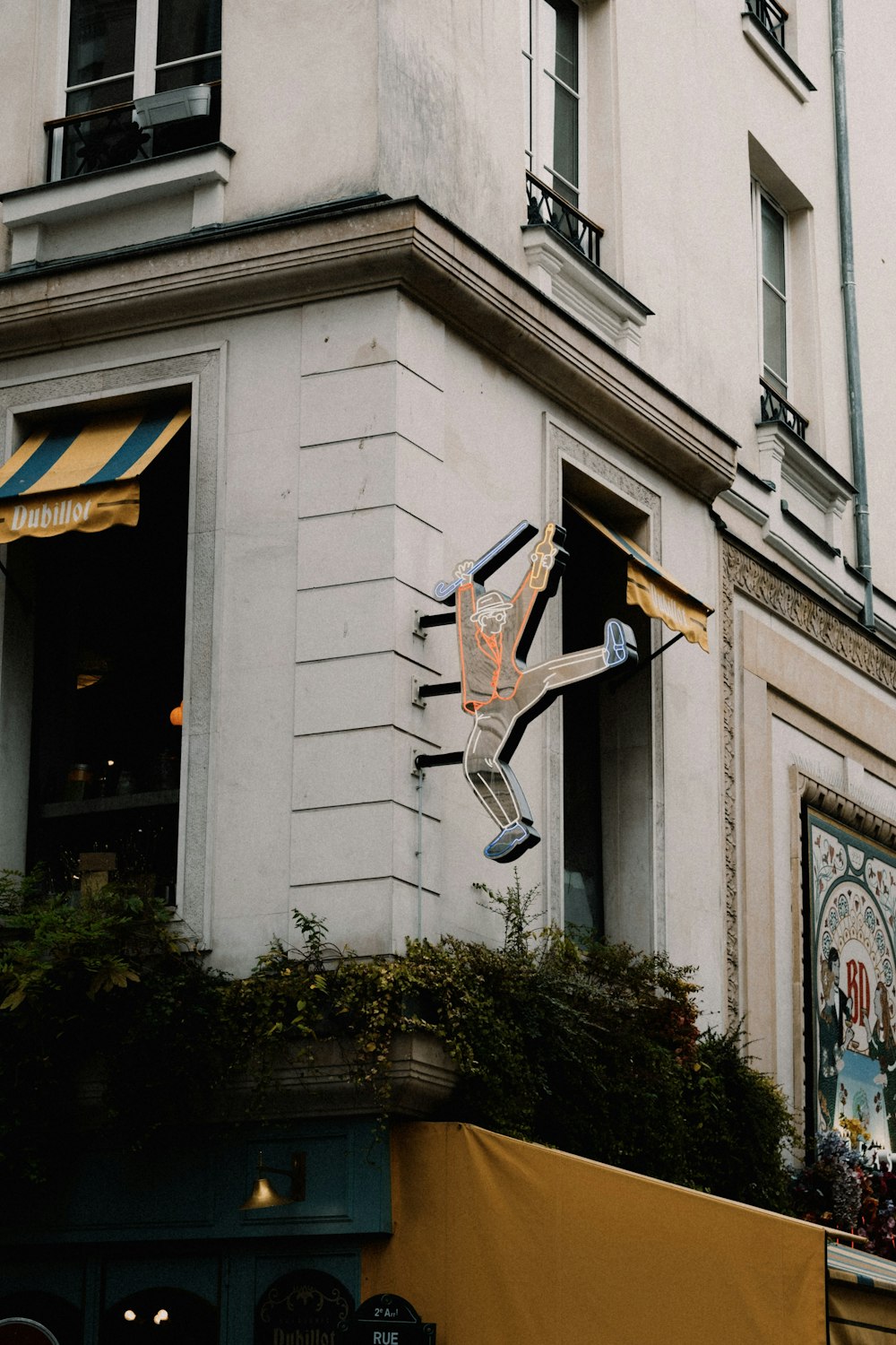 a skateboarder doing a trick on a building