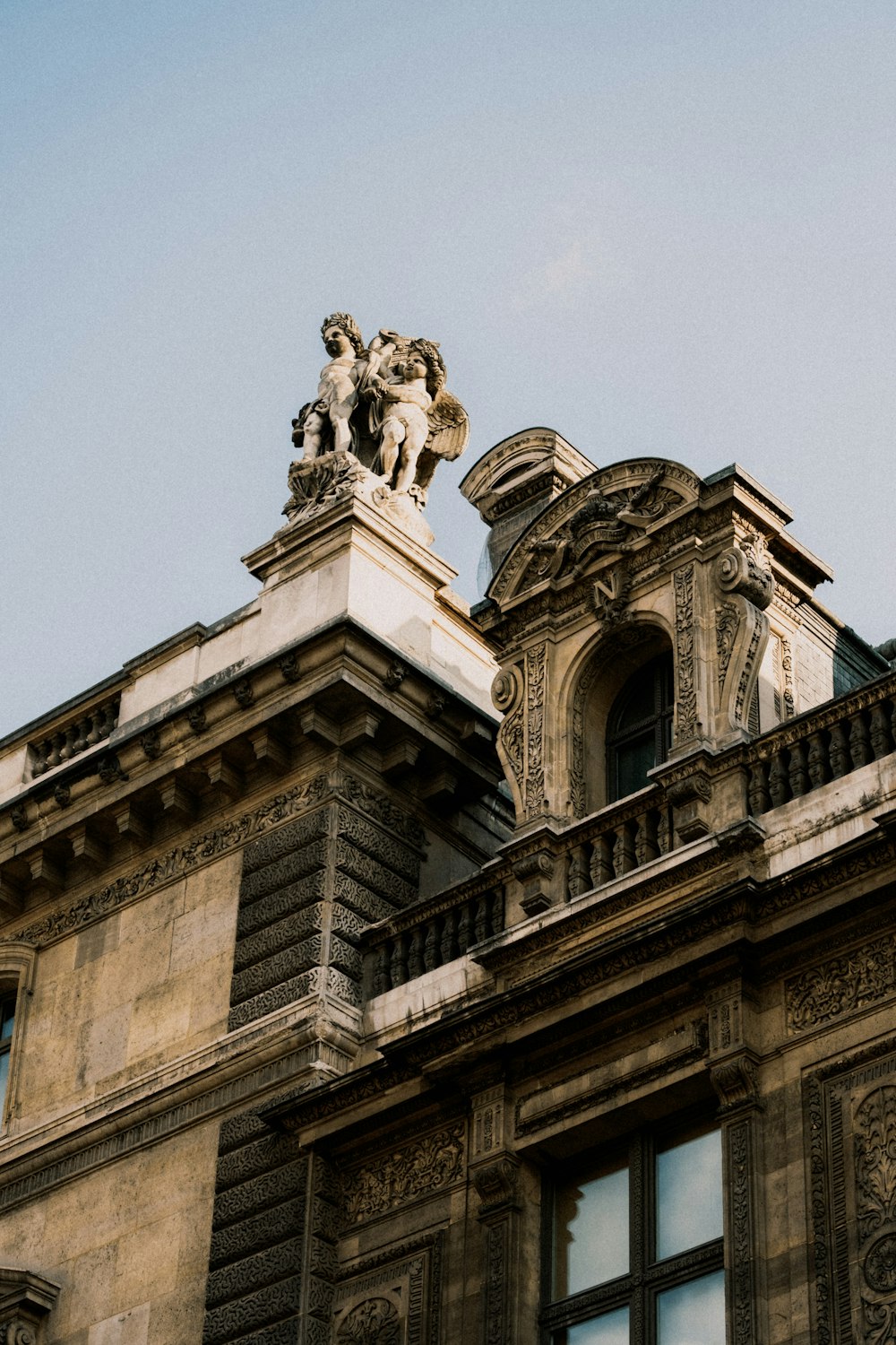 a building with a statue on top