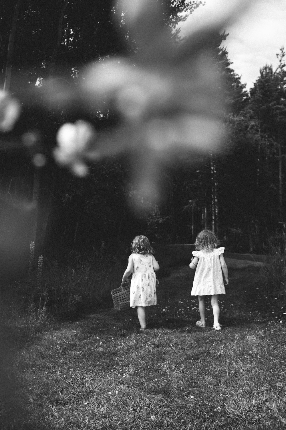 two children holding baskets